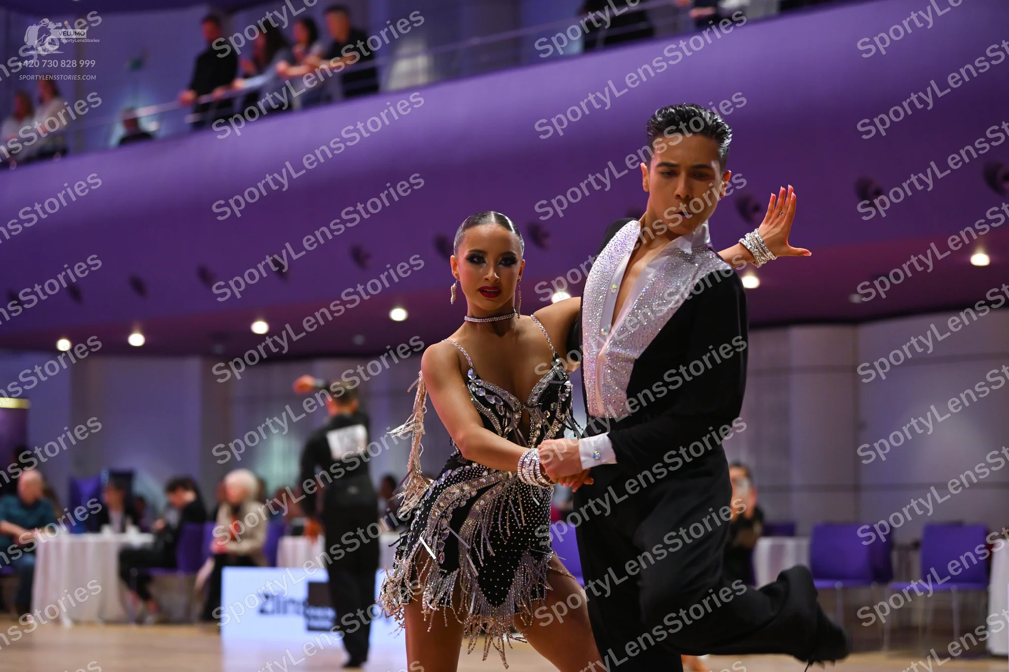 Dancesport competitor: Male dancer: black long-sleeved shirt with a large white satin or sequined front