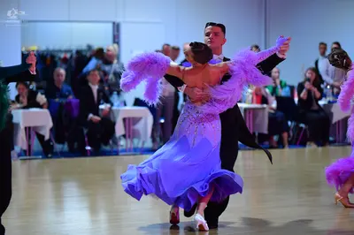 Dancesport competitor: Male dancer: black suit
