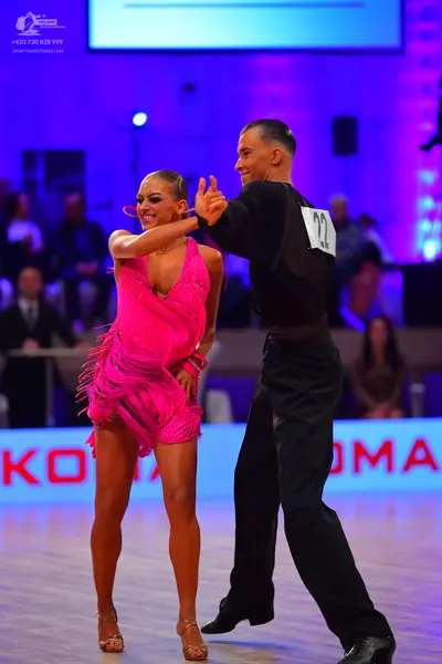 Dancesport competitor: Male dancer: black long-sleeved shirt and black trousers