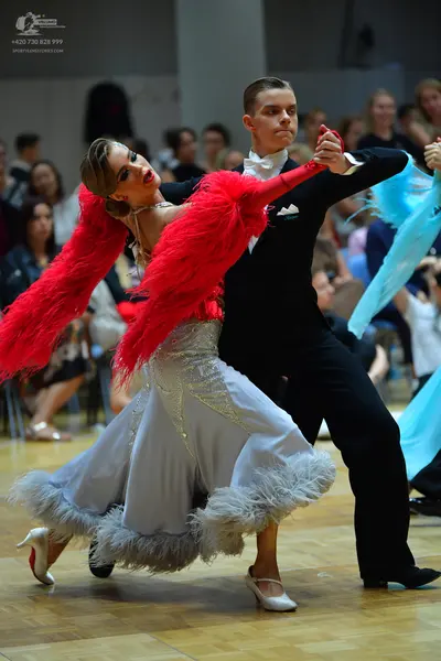 Dancesport competitor: Male dancer: black suit with a white shirt and white bowtie
