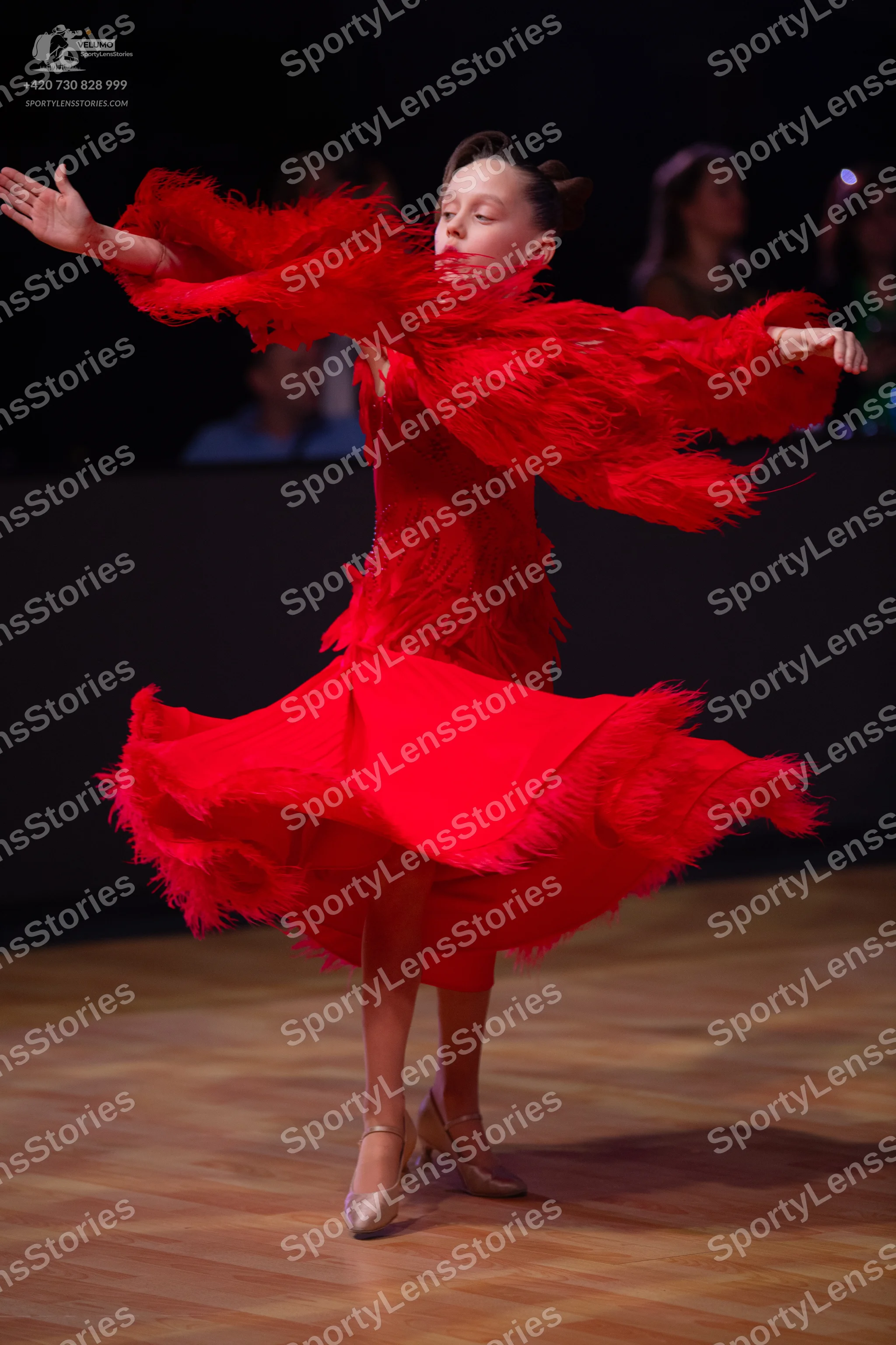 Dancesport competitor: Female dancer: red latin dress with fringe