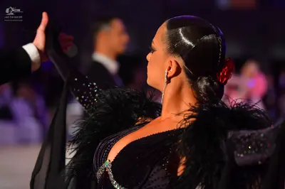 Dancesport competitor: Male dancer: black suit with a white shirt