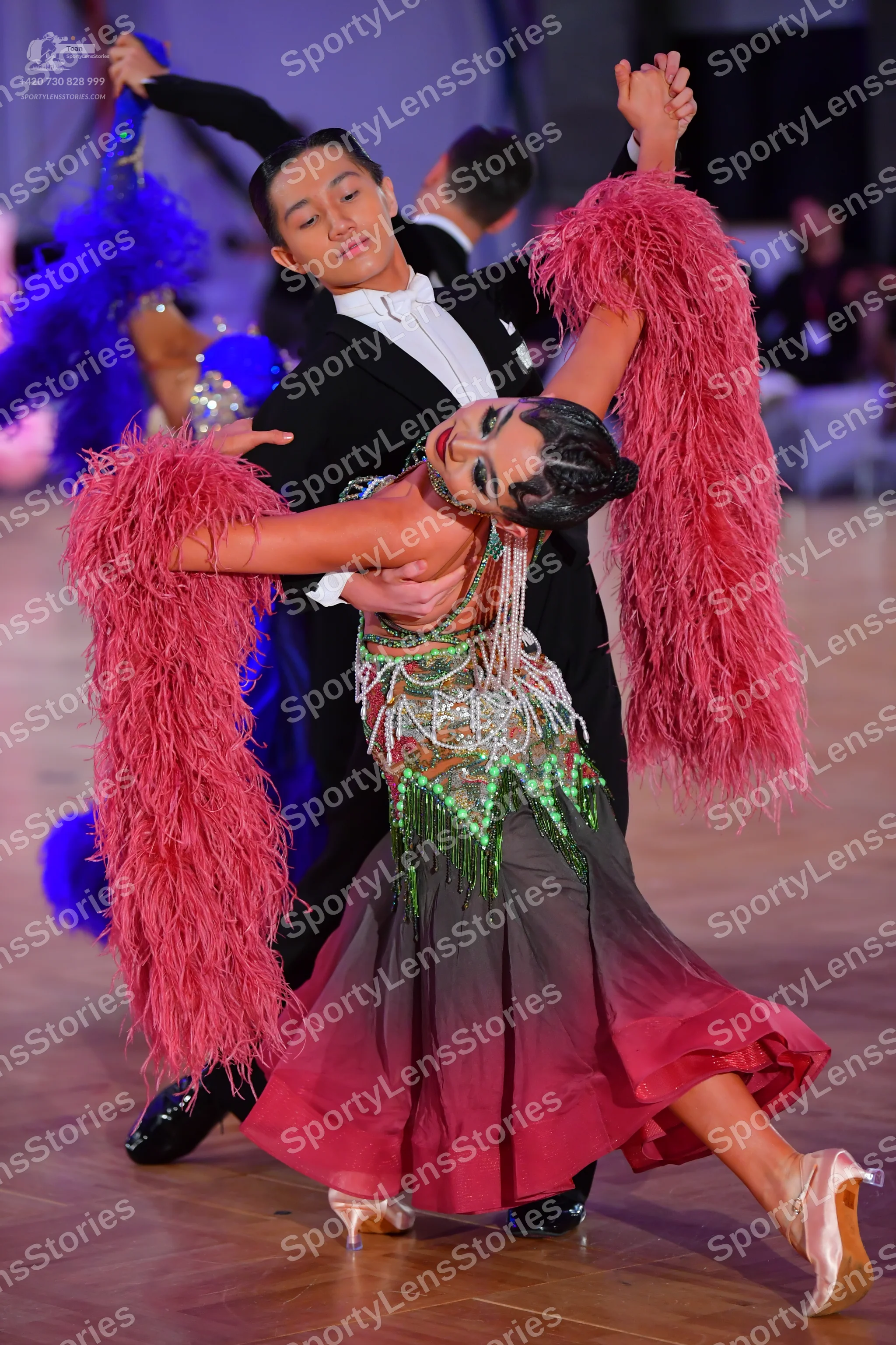 Dancesport competitor: Male dancer: black suit with a white shirt and black bowtie