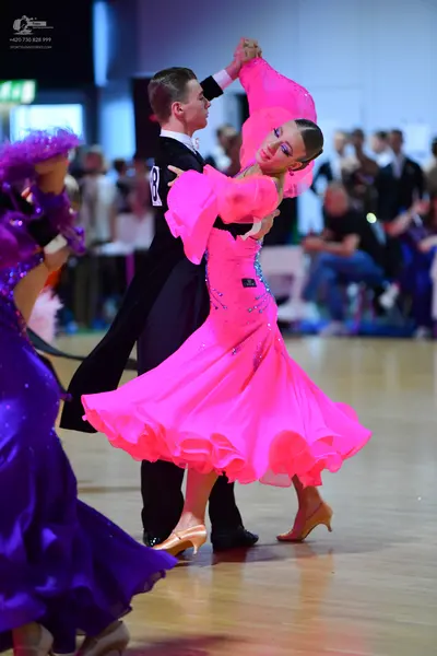 Dancesport competitor: Male dancer: black suit with a white shirt