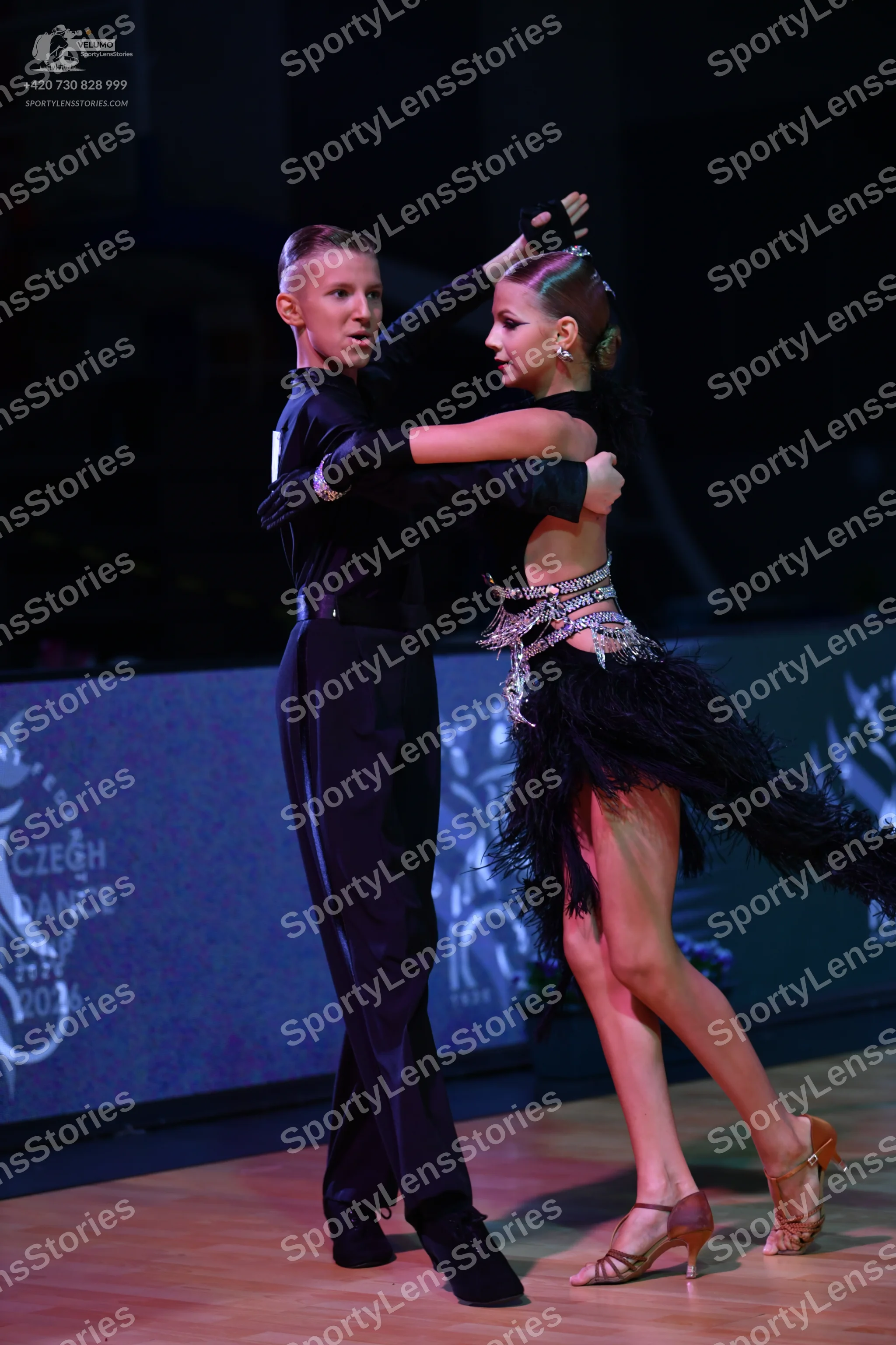 Dancesport competitor: Male dancer: black long-sleeved shirt and black trousers