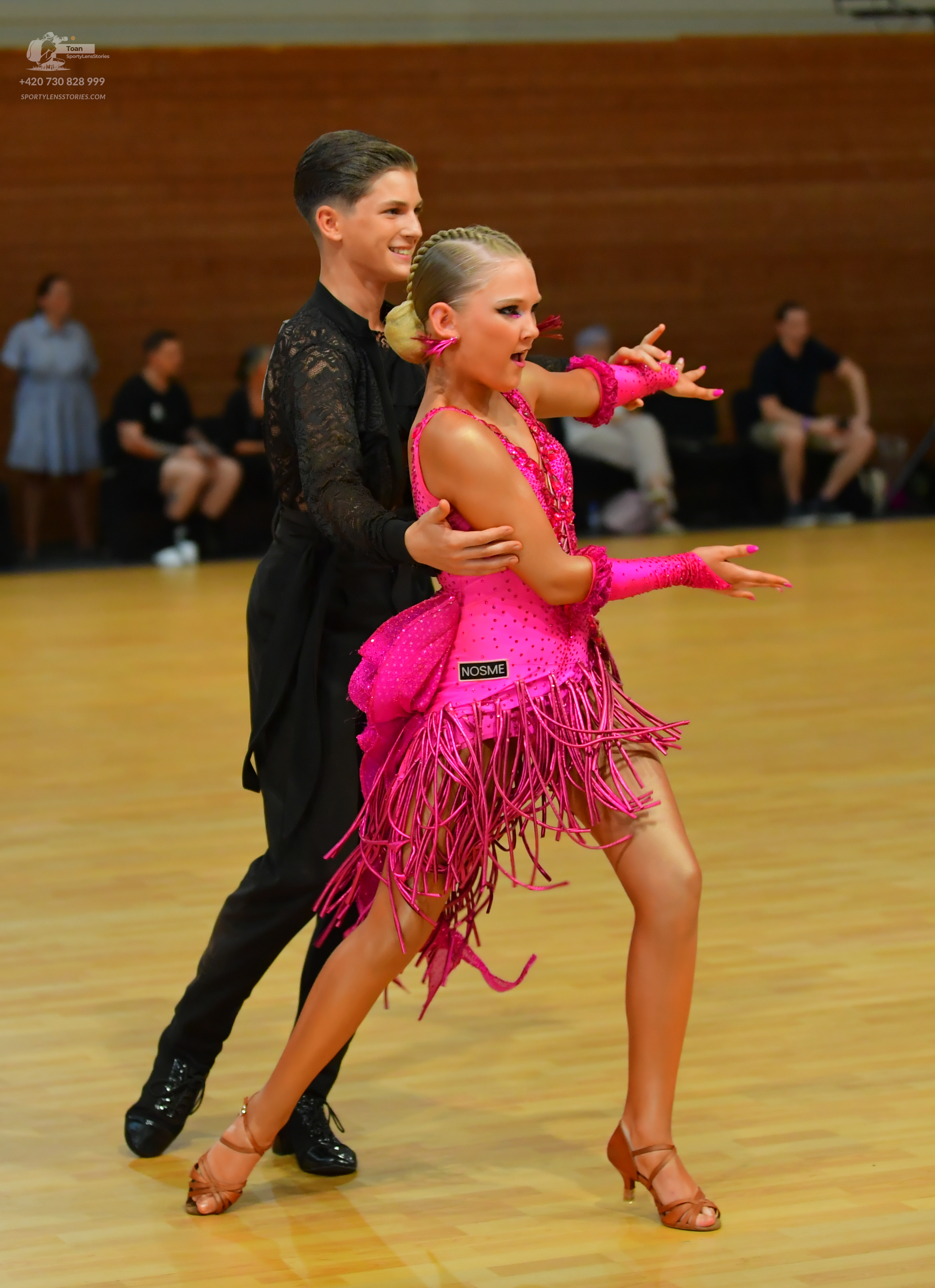 Dancesport competitor: ** Male: Black tail suit with sequin detailing on the lapels