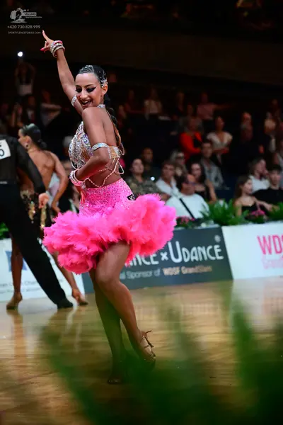Dancesport competitor: Male dancer: black long-sleeved shirt and black trousers