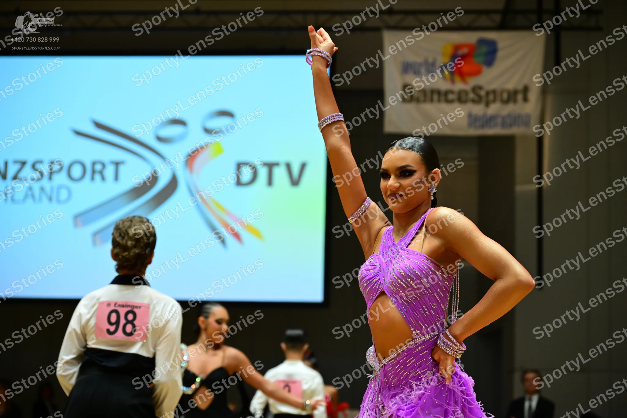 Dancesport competitor #98: Male dancer (left): black waistcoat over a white shirt