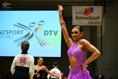Dancesport competitor #98: Male dancer (left): black waistcoat over a white shirt