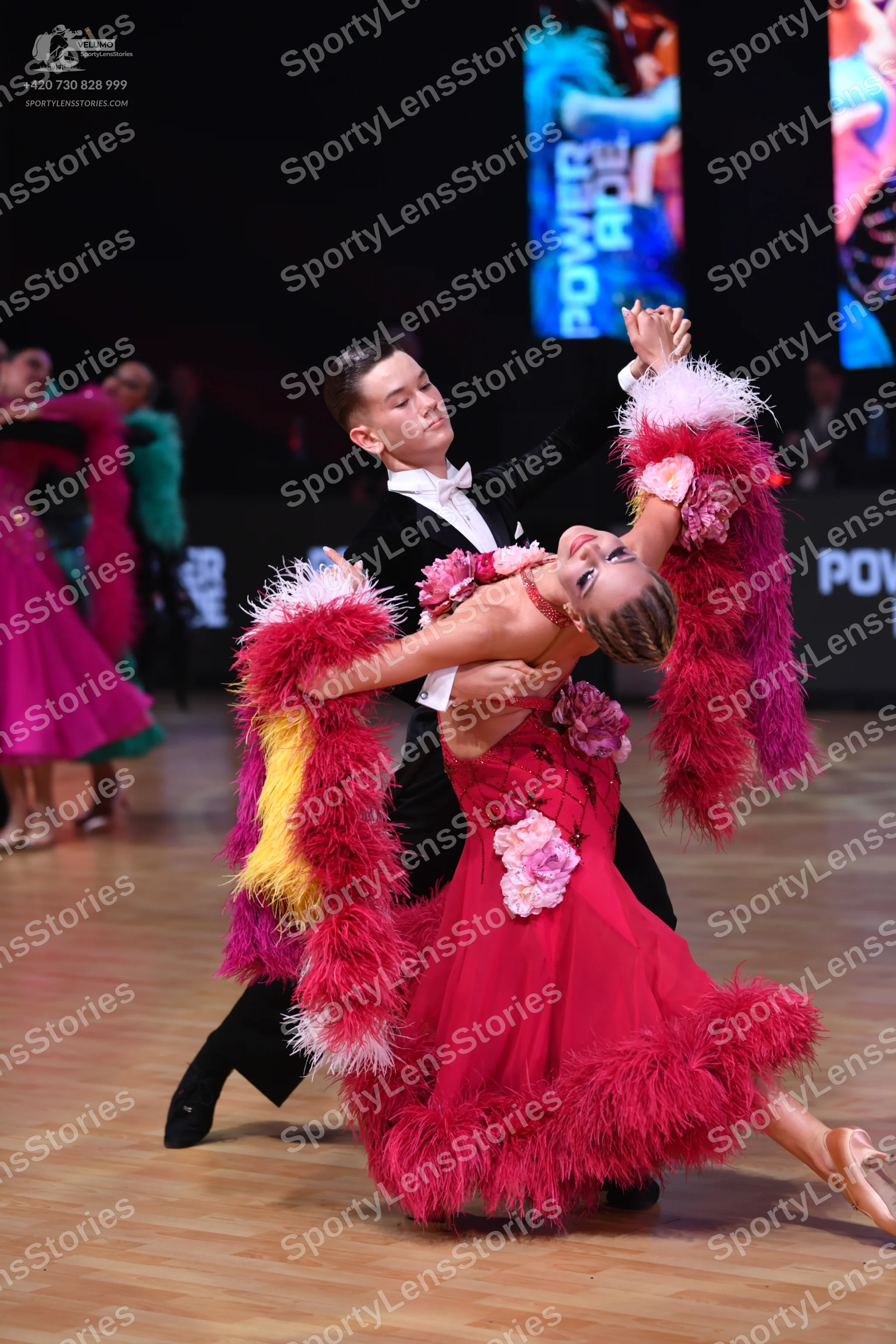 Dancesport competitor: Male dancer: black suit with a white shirt and white bow tie