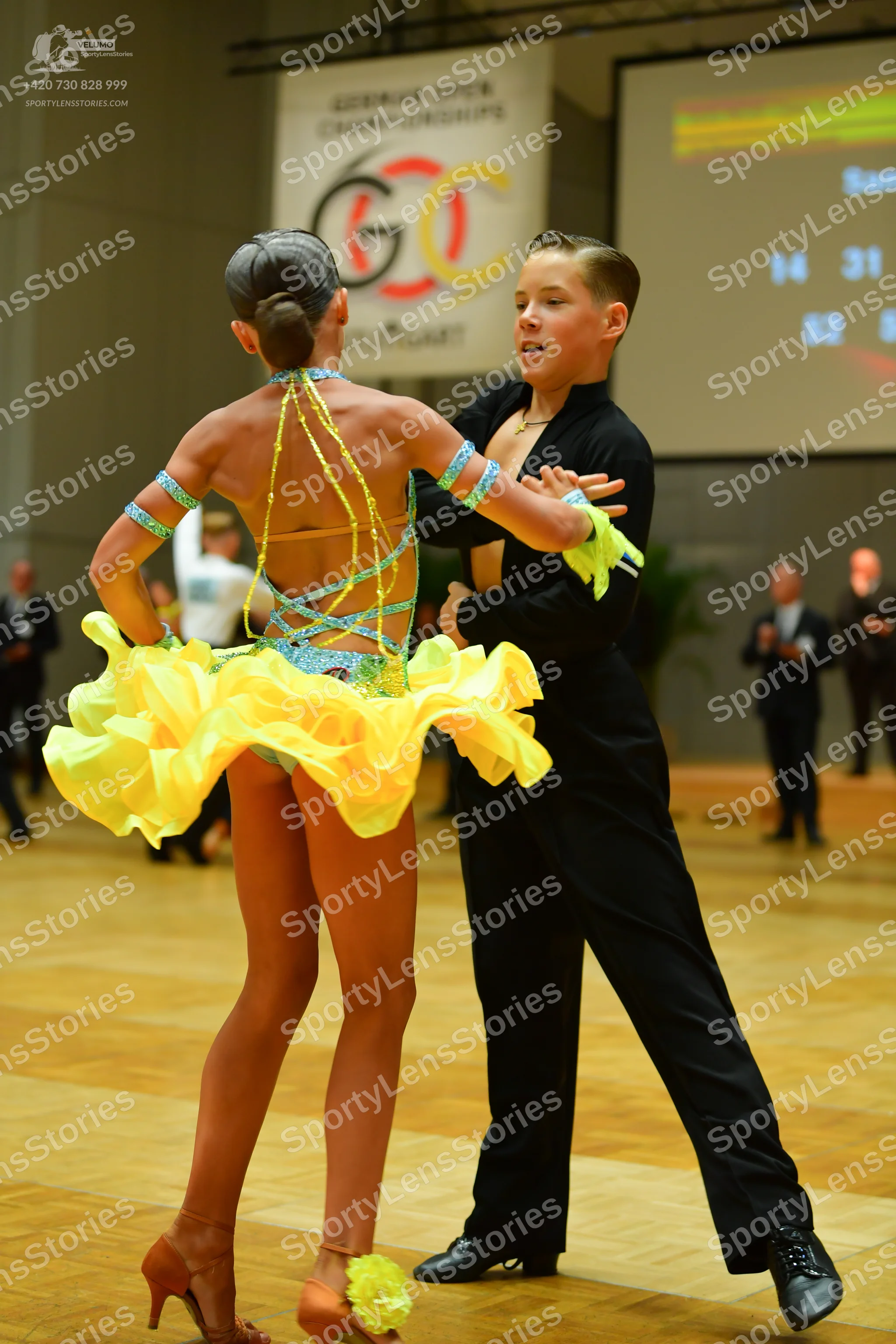 Dancesport competitor: Male dancer: black long-sleeved shirt and black trousers