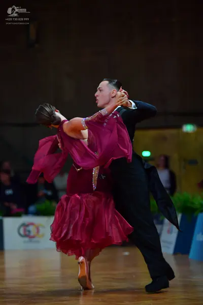Dancesport competitor: Male dancer: black suit with a white shirt and black bowtie