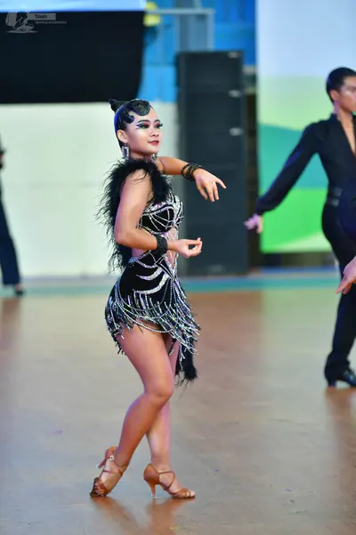Dancesport competitor: ** Male: Black suit with sequin lapels, dark shoes
