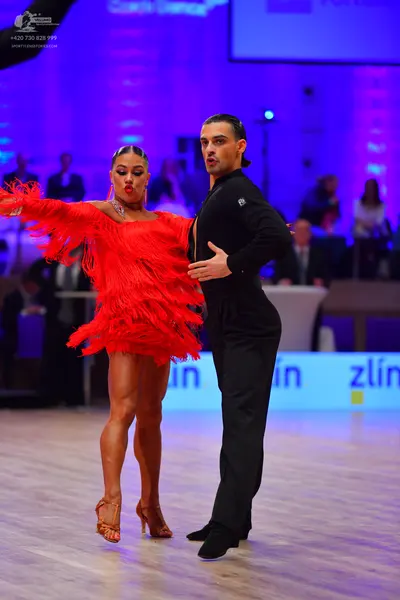 Dancesport competitor: Male dancer: black long-sleeved shirt and black trousers