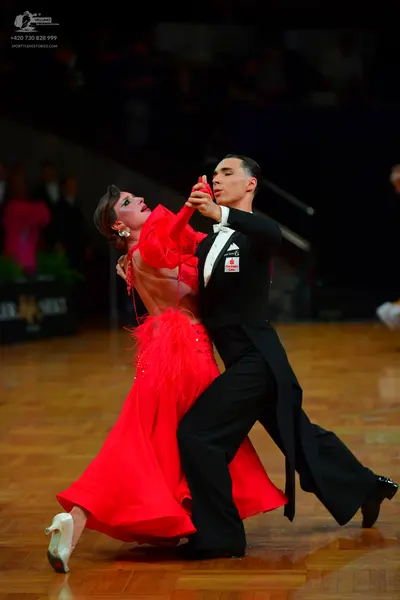 Dancesport competitor: Male dancer: black tailcoat suit with a white collar and black bowtie