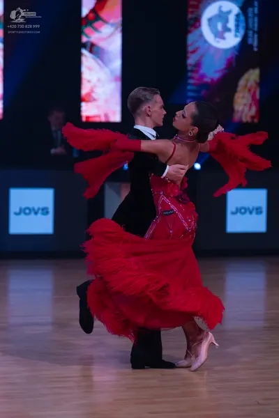 Dancesport competitor: Male dancer: black suit with a white shirt and bowtie