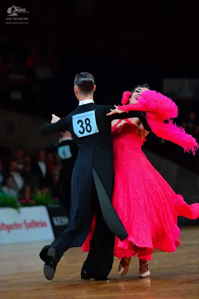 Dancesport competitor #38: Male dancer: black tailcoat and black trousers
