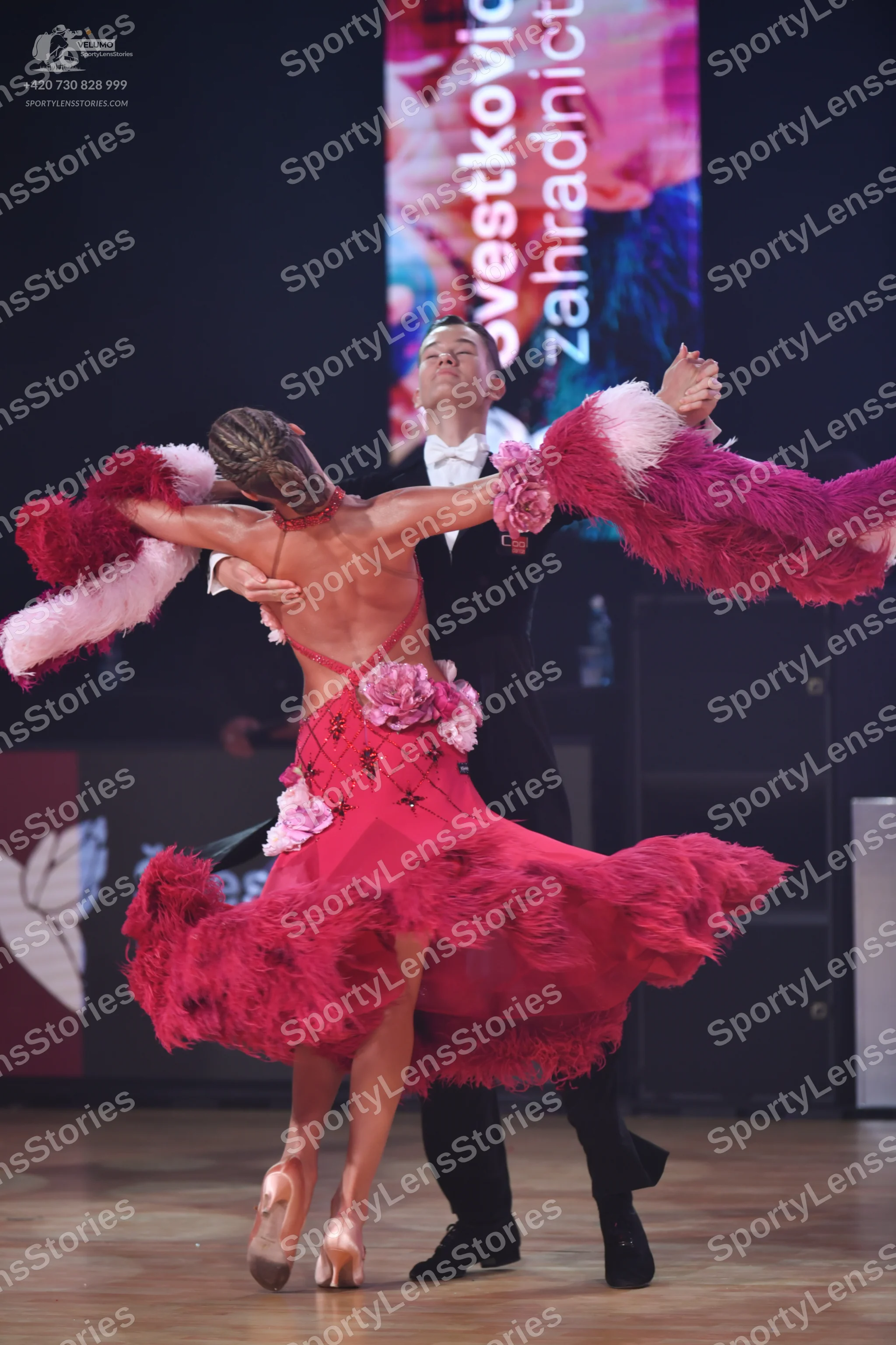 Dancesport competitor: Male dancer: black suit with a white shirt and white bow tie