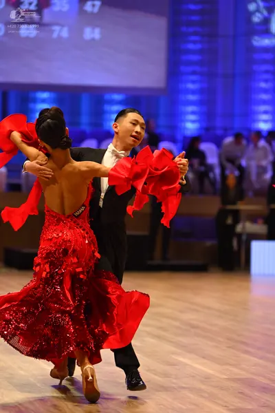 Dancesport competitor: Male dancer: black suit with a white shirt