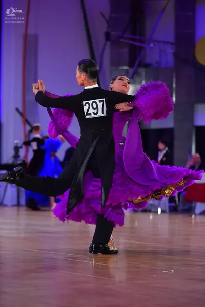 Dancesport competitor #297: Male dancer: black long-sleeved top and black trousers
