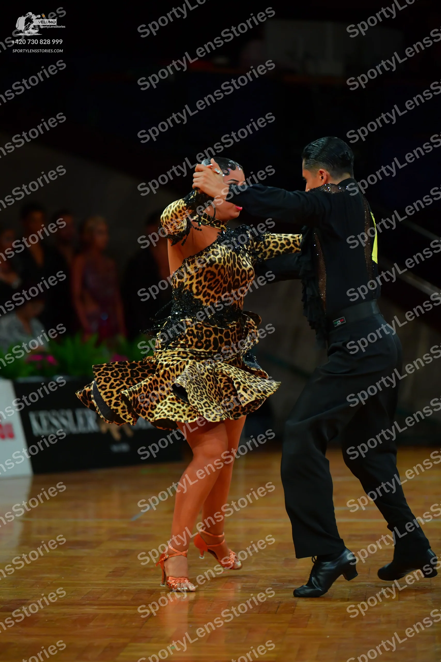 Dancesport competitor: Male dancer: black long-sleeved shirt and black trousers