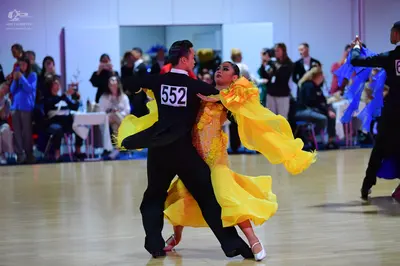 Dancesport competitor #552: Male dancer (center): black suit