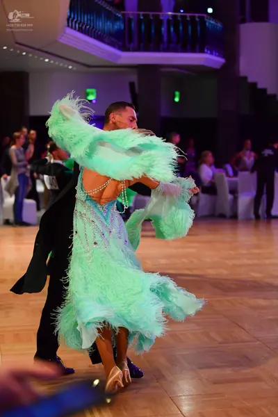Dancesport competitor: Male dancer: black suit