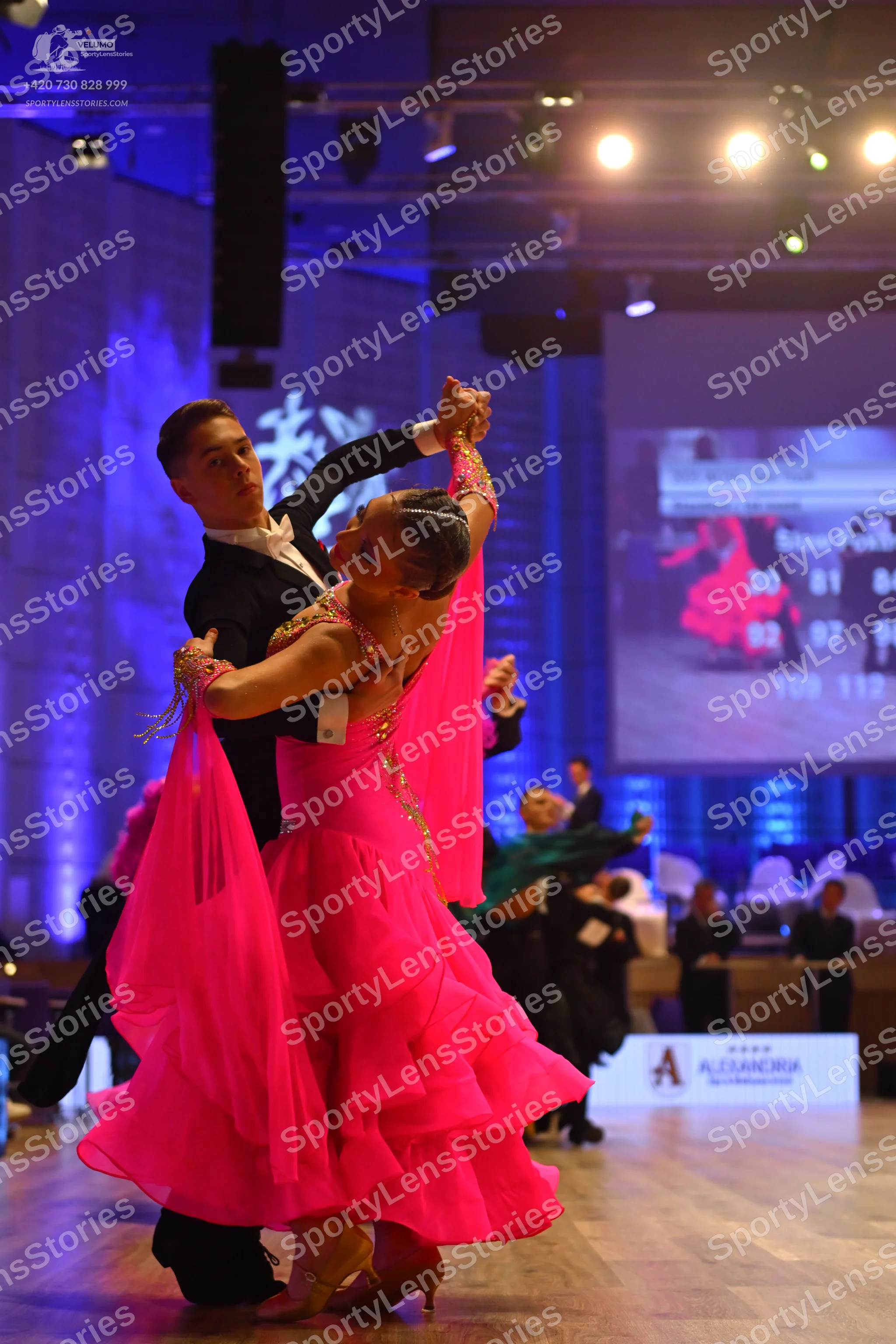 Dancesport competitor: Male dancer: black suit with a white shirt