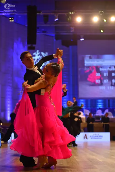 Dancesport competitor: Male dancer: black suit with a white shirt