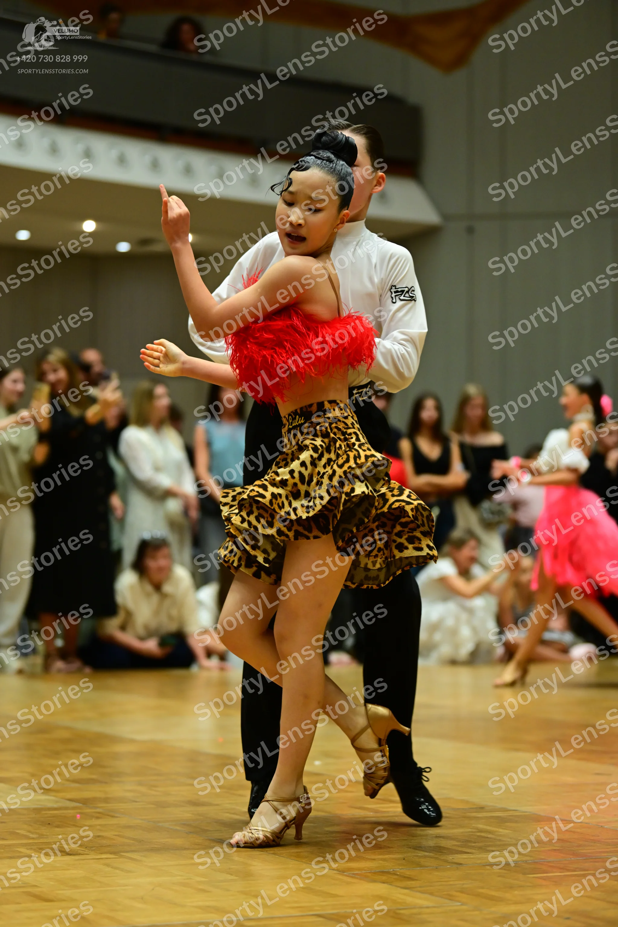Dancesport competitor: Male dancer: white long-sleeved shirt and black trousers