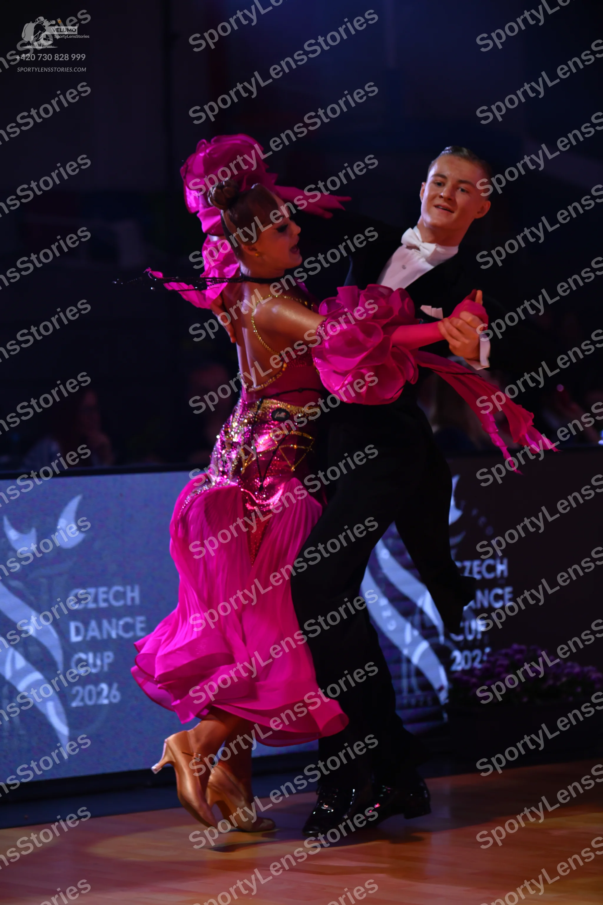 Dancesport competitor: Male dancer: black suit with a white shirt