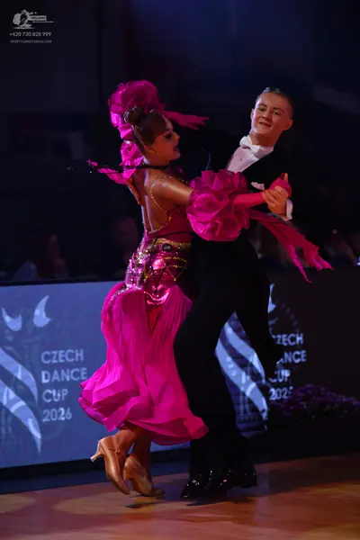 Dancesport competitor: Male dancer: black suit with a white shirt