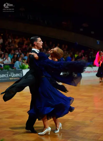Dancesport competitor: Male dancer: black tailcoat, white shirt, and black bowtie