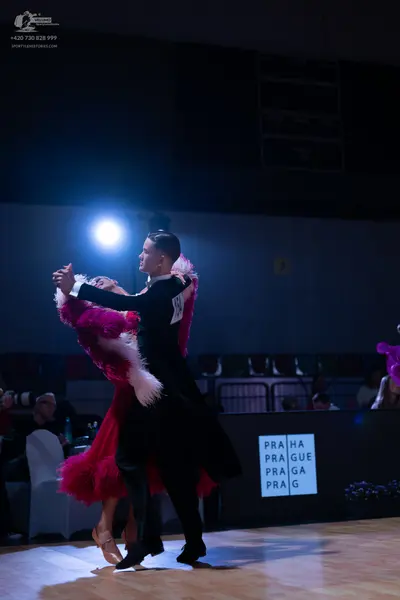 Dancesport competitor: Male dancer: black suit/tailcoat