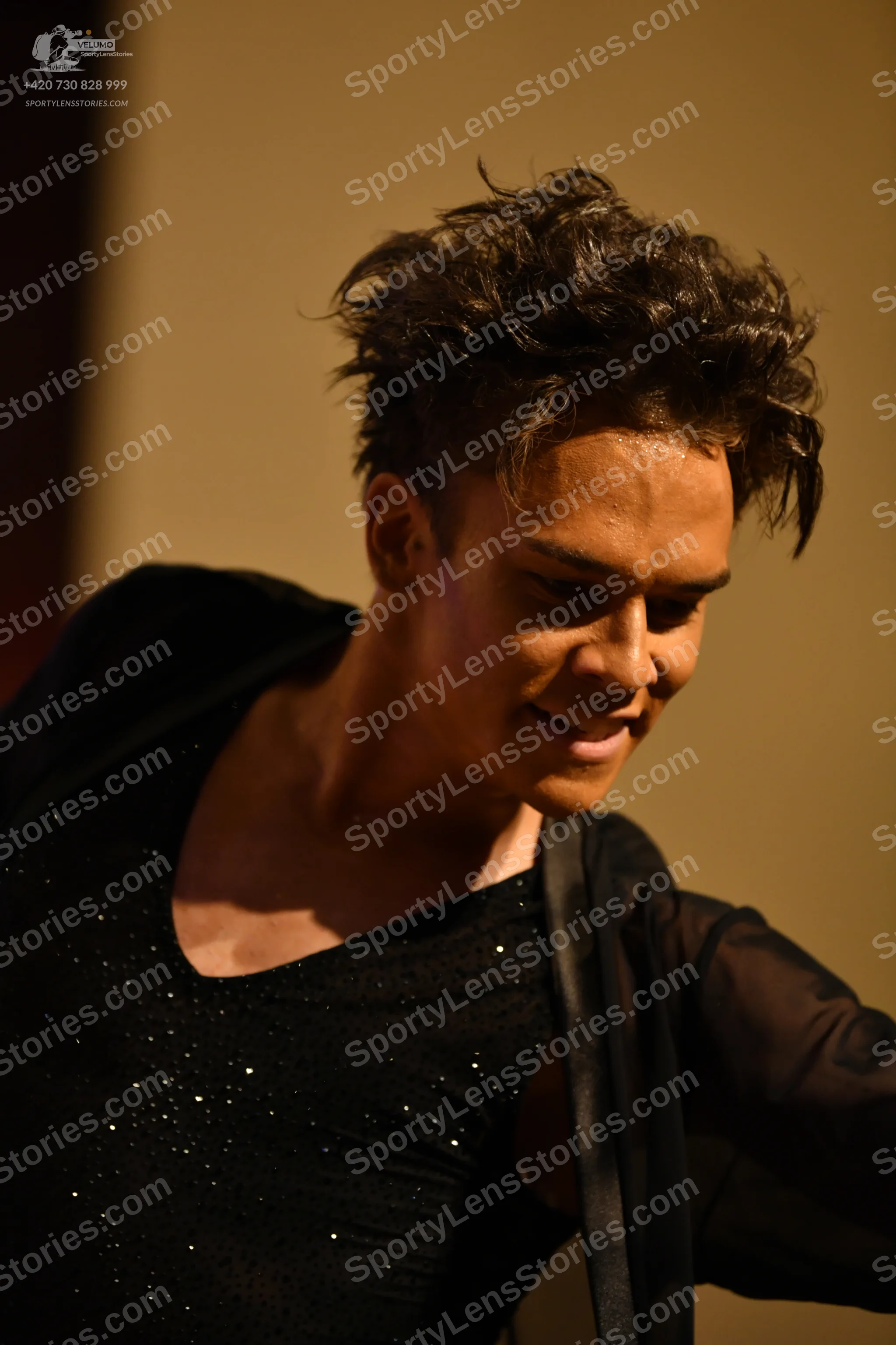 Dancesport competitor: ** 
*   **Male:** Black sequins bodysuit with a sculpted, fitted silhouette