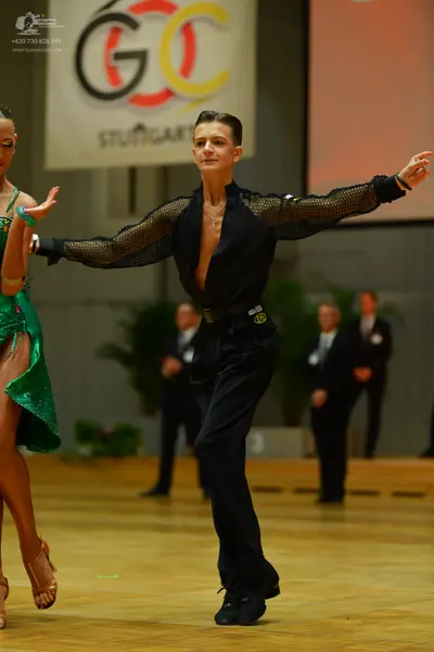 Dancesport competitor: Female dancer: green sequined Latin dress