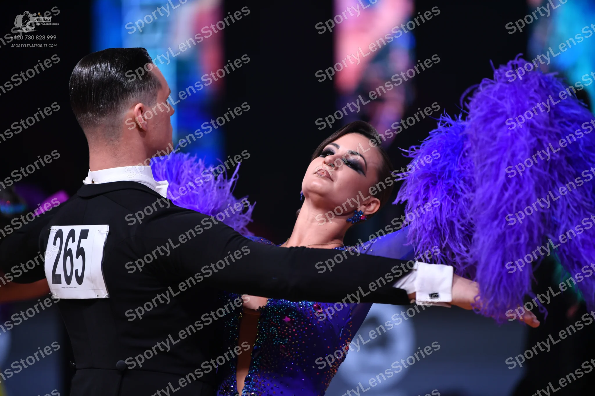Dancesport competitor: Male dancer: black suit with a white shirt and white bow tie