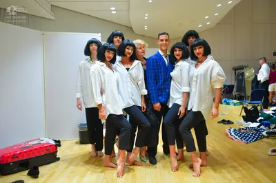 Dancesport competitor: Male dancer: blue patterned blazer, white shirt, and black trousers