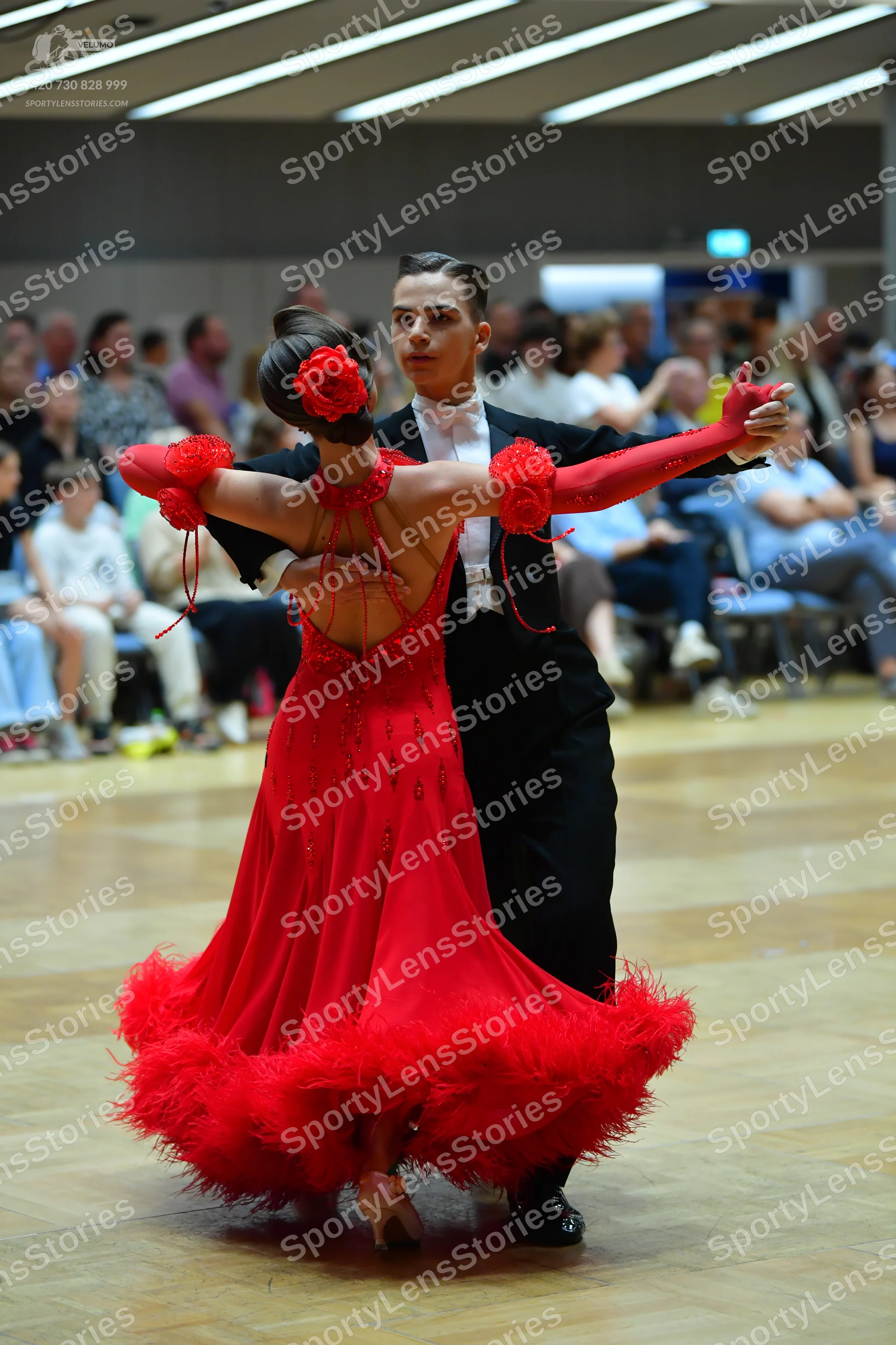 Dancesport competitor: Male dancer: black suit with a white shirt and black trousers