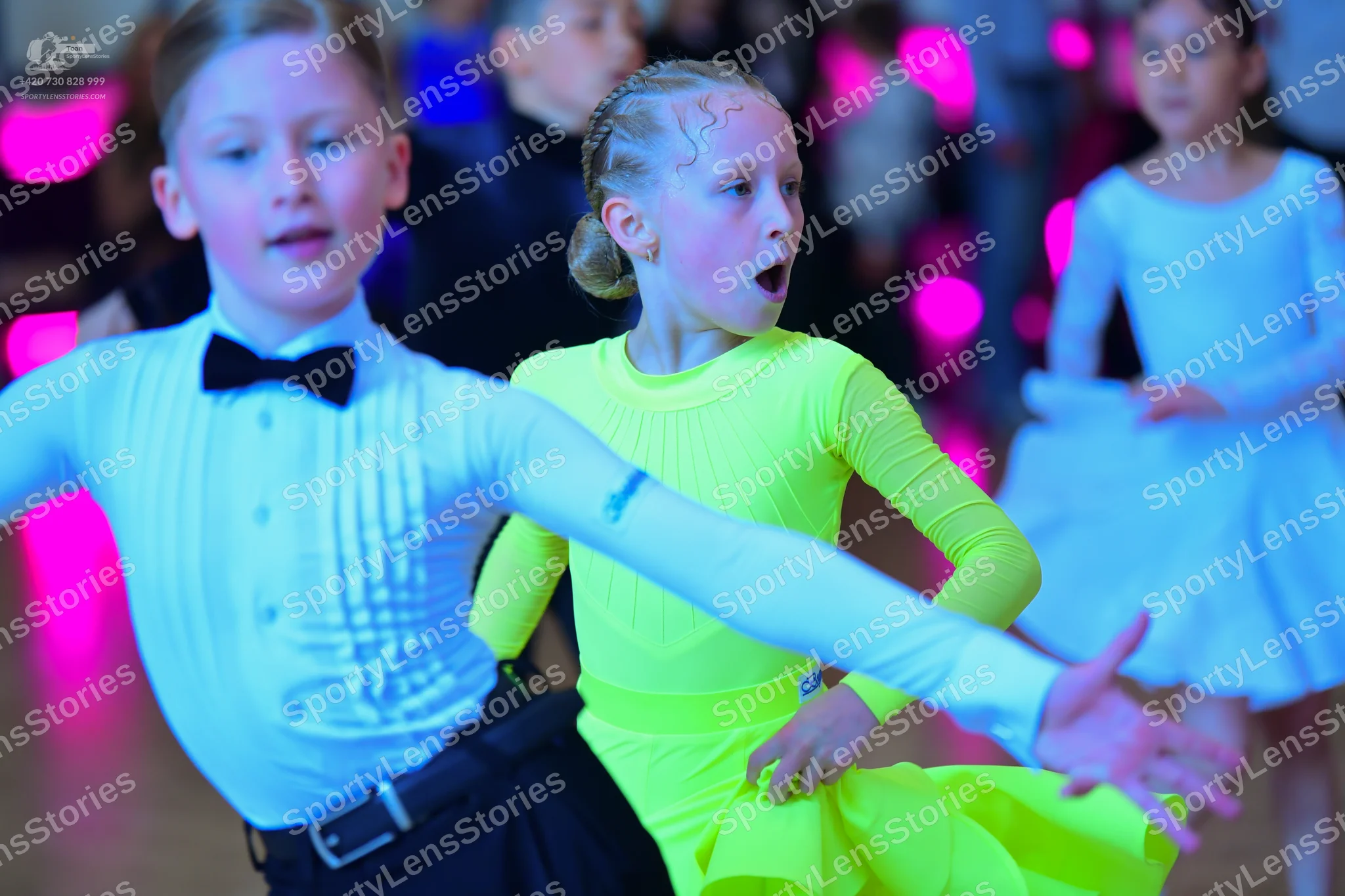 Dancesport competitor: Male dancer: white long-sleeved shirt with a pleated front, black bow tie, and b