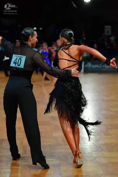 Dancesport competitor #40: Male dancer: black long-sleeved shirt and black trousers