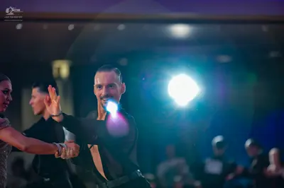 Dancesport competitor: Female dancer: champagne-colored sequined top