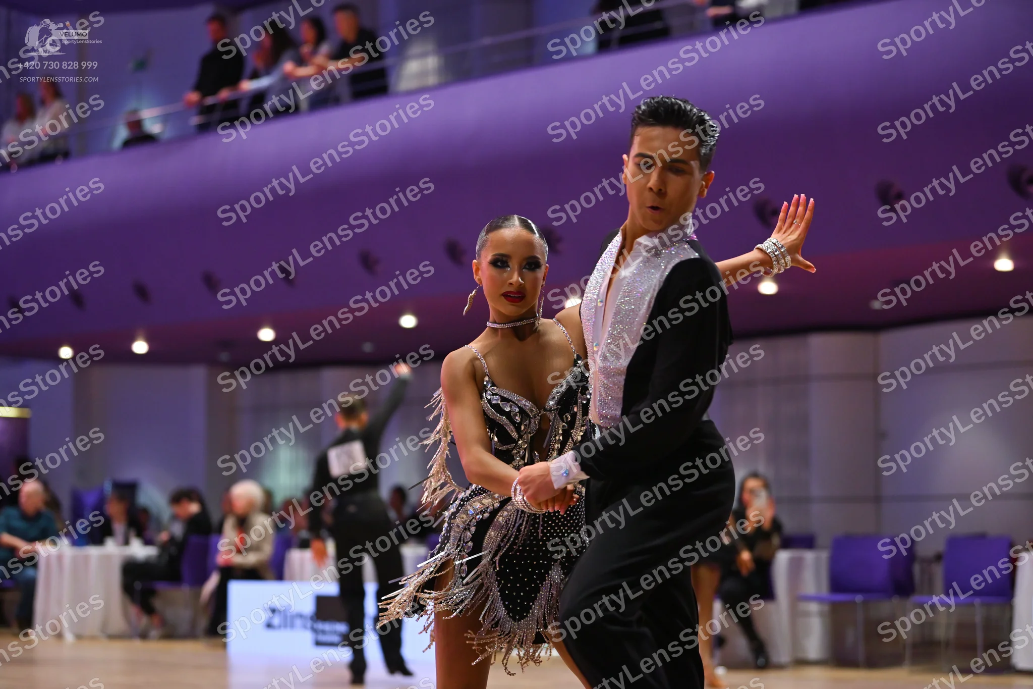 Dancesport competitor: Male dancer: black long-sleeved dance shirt with white collar detail and black t