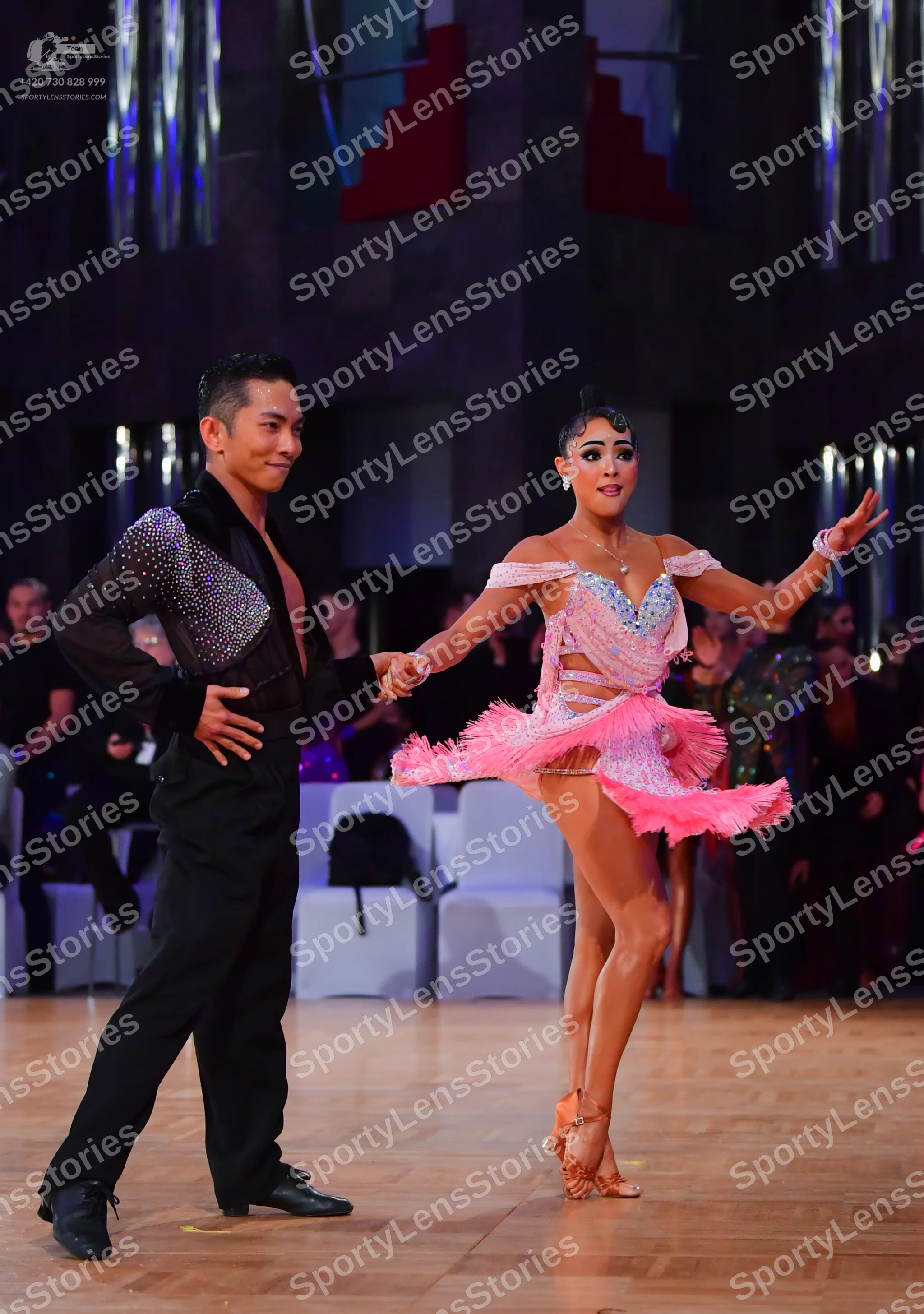 Dancesport competitor: Male dancer: black long-sleeved shirt with silver sequins on the shoulder and bl