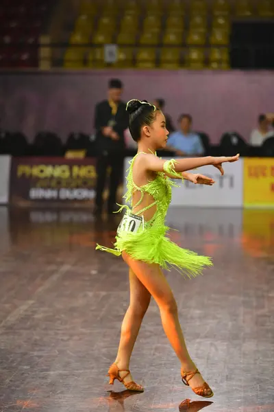 Dancesport competitor #101: Female dancer: lime green Latin dress with fringe