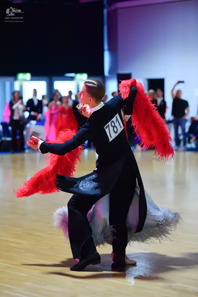 Dancesport competitor #781: Male dancer: black formal suit with a white collar