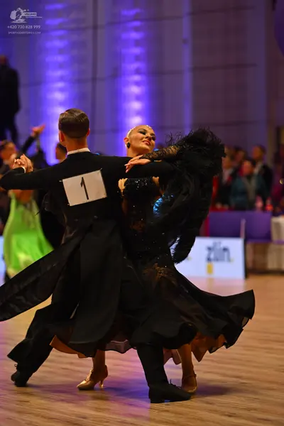 Dancesport competitor: Male dancer: black suit