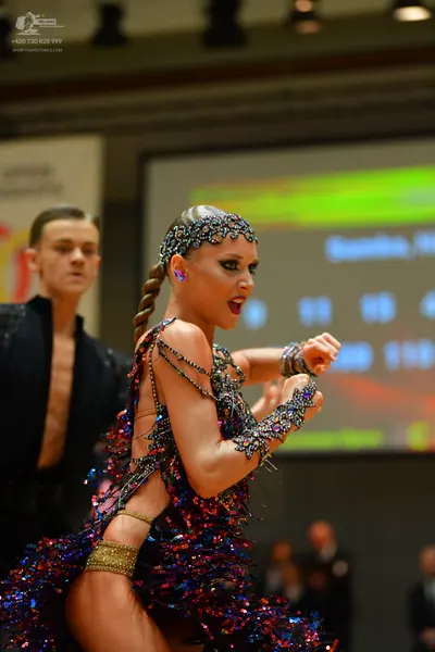 Dancesport competitor: Male dancer: black open-chest Latin dance shirt