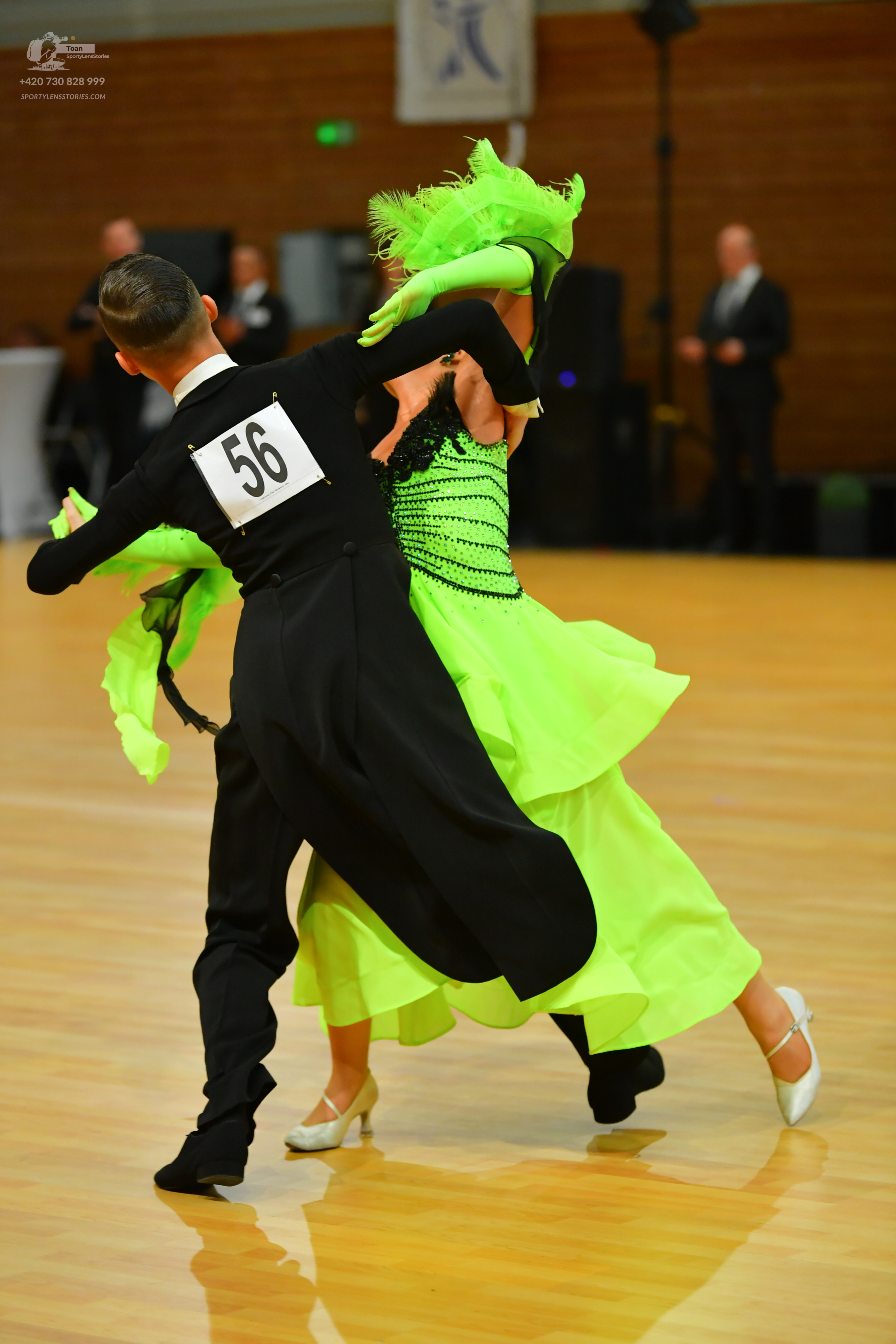 Dancesport competitor: Male:** Black tailsuit with a sequin lapel and black shoes
