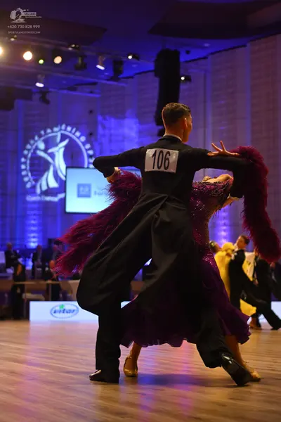 Dancesport competitor: Male dancer: black ballroom suit